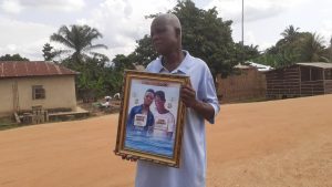 Mr. Daniel Damptey showing 2 sons who died